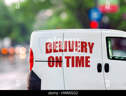 Free delivery, van on city street Stock Photo