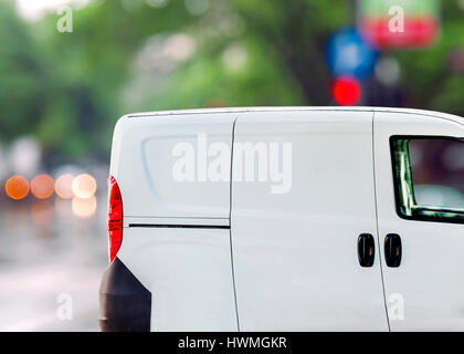 Free delivery, van on city street Stock Photo