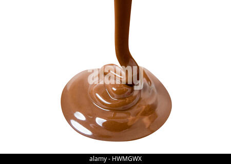 Melted hot chocolate is pouring. Isolated on white with clipping path Stock Photo