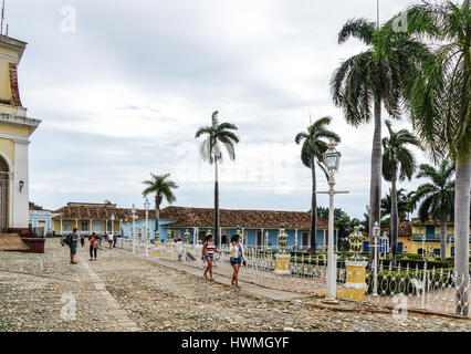 Trinidad, Cuba - January 14, 2016: Typical scene of one of streets in the center of Trinidad, Cuba - colonial architecture, people walking around Stock Photo