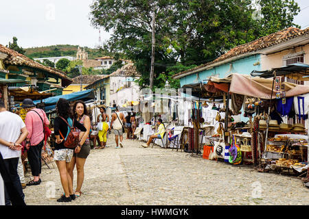 Trinidad, Cuba - January 14, 2016: Typical scene of one of streets in the center of Trinidad, Cuba - colonial architecture, people walking around, str Stock Photo