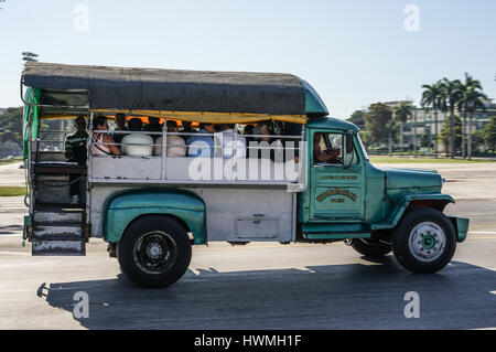 Santiago de Cuba, Cuba - January 11, 2016: Typical scene of one of streets in the center of Santiago de cuba - vintage american cars on the roads. San Stock Photo