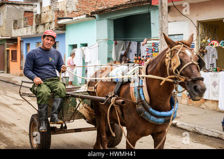 Trinidad, Cuba - January 14, 2016: Trinidad's residents still use horse-drawn carriages as the preferred vehicle. Cuba has one of lowest vehicle per c Stock Photo