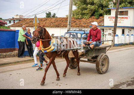 Trinidad, Cuba - January 14, 2016: Trinidad's residents still use horse-drawn carriages as the preferred vehicle. Cuba has one of lowest vehicle per c Stock Photo