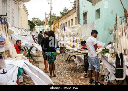 Trinidad, Cuba - January 14, 2016: Typical scene of one of streets in the center of Trinidad, Cuba - colonial architecture, people walking around, str Stock Photo