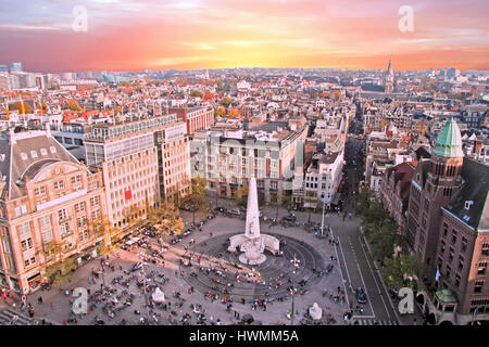 City scenic from Amsterdam with the Dam in the Netherlands at sunset Stock Photo