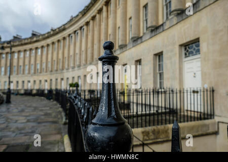 Selective focus on black wrought iron railings with the sweep of grand Georgian architecture of Royal Crescent Bath England in background Stock Photo