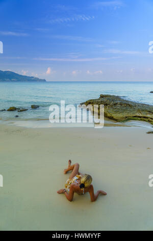 Woman on the beach in Surin Phuket Thailand Stock Photo