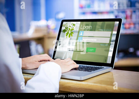 Close-up of login page against businessman using a laptop Stock Photo