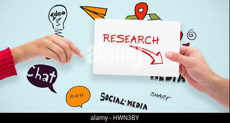 Hands holding card against blue background Stock Photo