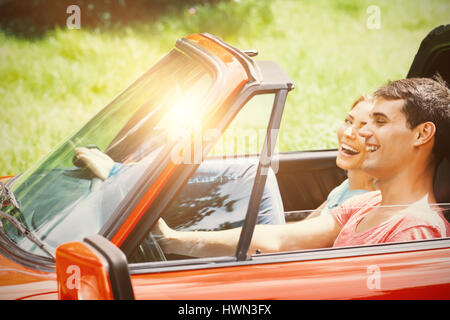 Couple having fun in a red car Stock Photo