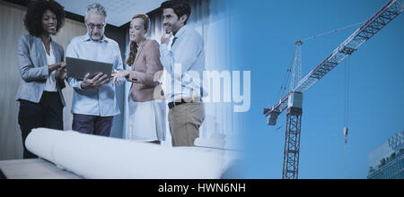 Studio Shoot of a crane  against low angle view of skyscrapers Stock Photo