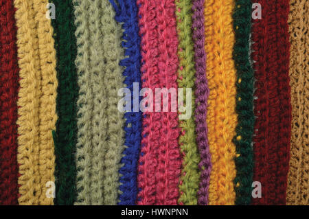 Knitted fine wool garment colorful stripes background natural texture, yellow, beige, claret, pink, blue, green scarf macro closeup, large detailed te Stock Photo