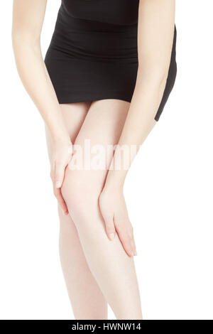 Woman with black dress and tired legs isolated on white, clipping path Stock Photo