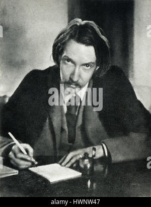 Robert Louis Stevenson, 1885 portrait photograph of the popular author of Treasure Island, aged 35 writing in his university gown Stock Photo