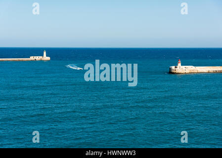 A view into the Grand Harbour and harbour entrance and fortifications at at Valetta Malta Stock Photo