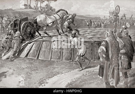 A Roman military exercise in the days of Julius Caesar, testing the Testudo - a military chariot being driven onto the roof of a Testudo or Tortoise formation in order to test its strength. In the testudo formation, the men would align their shields to form a packed formation covered with shields on the front and top.  After the painting by Fortunino Matania, (1881 –1963).  From Hutchinson's History of the Nations, published 1915. Stock Photo