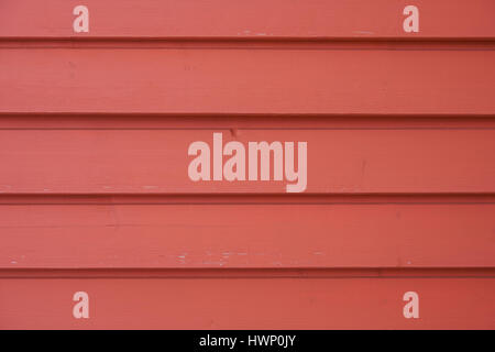 Exterior red wooden lining as a background Stock Photo