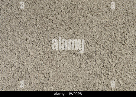 Gray cement structered finishing on the foundation of the house Stock Photo