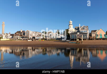 Provincetown landscape showing buildings on the bay, the famous Pilgrim Monument & historical United Methodist Church (now the Public Library). Stock Photo