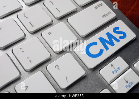 CMS Content Management System on a keyboard button. Stock Photo