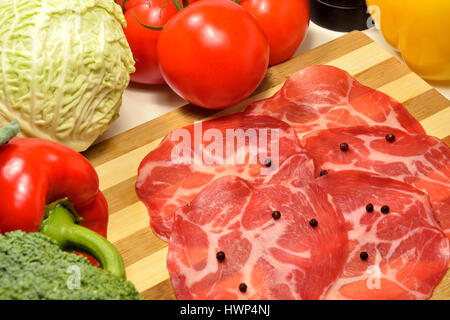 Coppa , Italian smoked pork ham whith raw vegetables Stock Photo