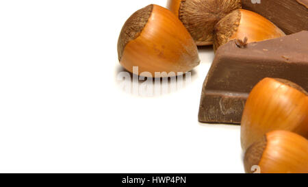 Chocolate and hazelnuts isolated on white background Stock Photo