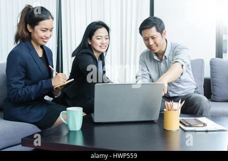 Success business team concept. Group of asian peoples dicussing something while working in office. Stock Photo