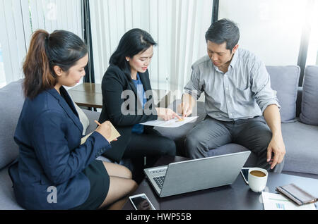 Success business team concept. Group of asian peoples dicussing something while working in office. Stock Photo