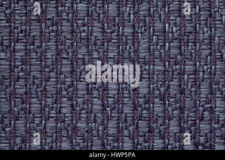 Navy blue knitted woolen background with a pattern of soft, fleecy cloth. Texture of denim textile closeup. Stock Photo