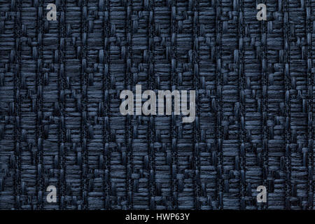 Navy blue knitted woolen background with a pattern of soft, fleecy cloth. Texture of denim textile closeup. Stock Photo