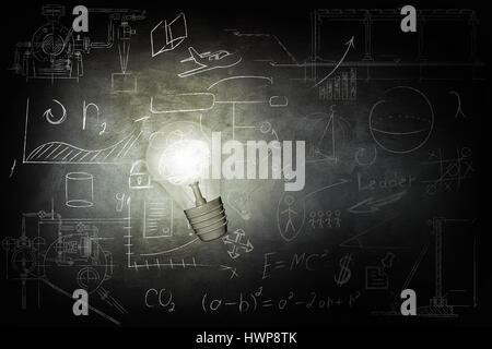 Bulb Illuminates mathematics and business icons on the school chalk board. 3d illustration. Stock Photo