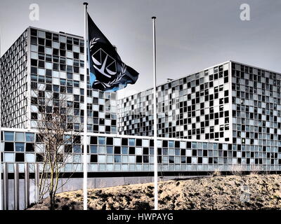 The Hague, Netherlands - March 27, 2016: The flag and the International Criminal Court at the new 2015 opened ICC building in dramatic colours. Stock Photo