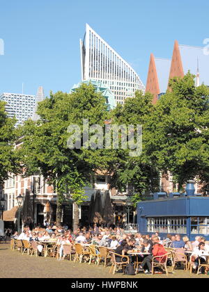 The Hague, Netherlands - July 8, 2016:  Patrons frequenting cafés and restaurants at the historic city square called  The Plain in The Hague in the af Stock Photo