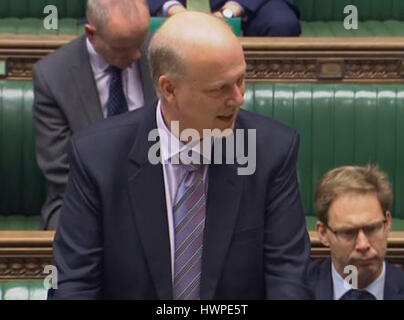 transport Secretary Chris Grayling answers a question on aviation security in the House of Commons, London, following the decision to ban UK-bound airline passengers from taking laptops onboard flights from six countries. Stock Photo