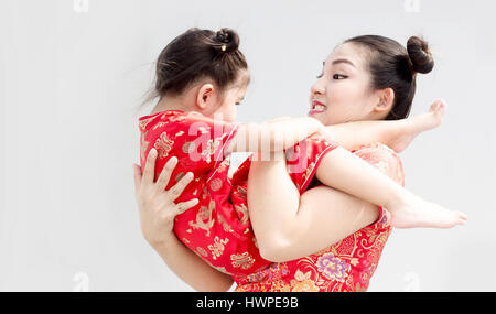 asian chinese daughter and mother big smile wih hug show happy time in new year festival Stock Photo