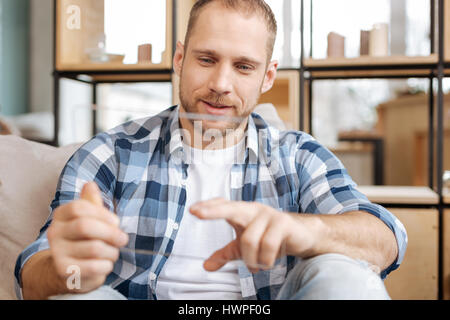 Attractive bearded man using new technologies Stock Photo