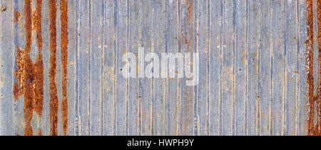 A banner background made of rusty zinc wall. Stock Photo