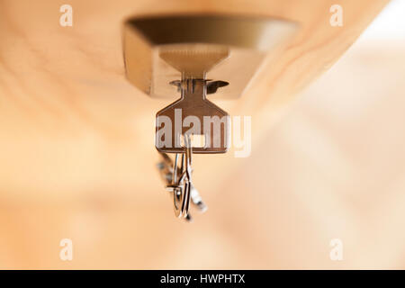Key in the lock of an entrance door Stock Photo