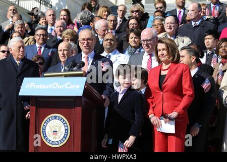 Washington, USA. 22nd Mar, 2017. U.S. Senate Minority Leader Chuck Schumer stands with House Minority Leader Nancy Pelosi, right, and California Gov. Jerry Brown, left, as Democrats held a rally marking the 7th anniversary of the  Affordable Care Act known as Obamacare on Capitol Hill March 22, 2017 in Washington, DC. Credit: Planetpix/Alamy Live News Stock Photo