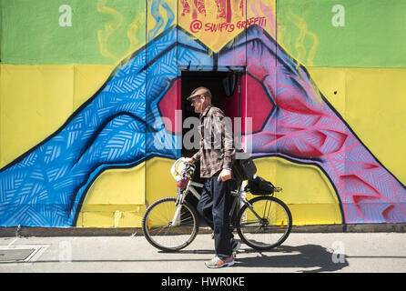 Adelaide, Australia. 4th Apr, 2017. Colourful art murals by various urban artists are showcased as part of the Adelaide fringe festival Street Art Explosion to connect art with the community across the city of Adelaide Credit: amer ghazzal/Alamy Live News Stock Photo