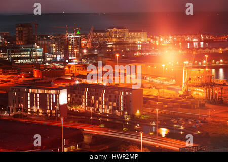 Illuminated buildings in city against sky Stock Photo