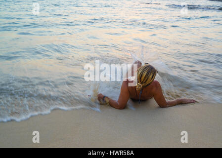 Woman on the beach in Surin Phuket Thailand Stock Photo