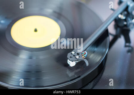 Record player with record playing with shallow depth of field Stock Photo