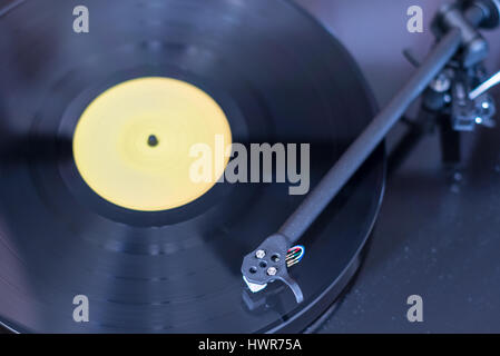 Record player with record playing with shallow depth of field Stock Photo