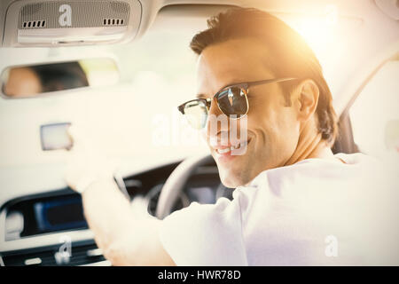 Smiling man using satellite navigation system in his car Stock Photo