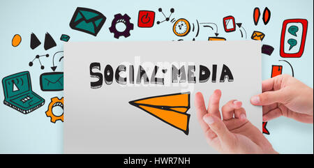 Hand showing card against blue background Stock Photo