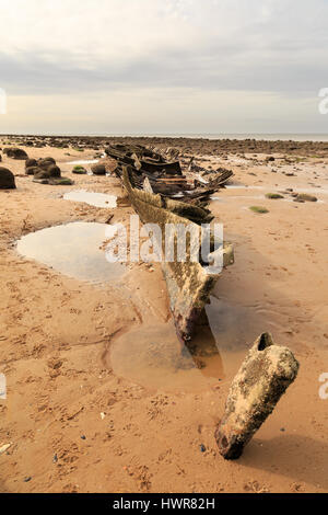 HUNSTANTON, ENGLAND - MARCH 10: Remains of shipwreck of the wooden steam trawler ship/boat 'Sheraton' on Hunstanton beach, Norfolk. In Hunstanton, Nor Stock Photo