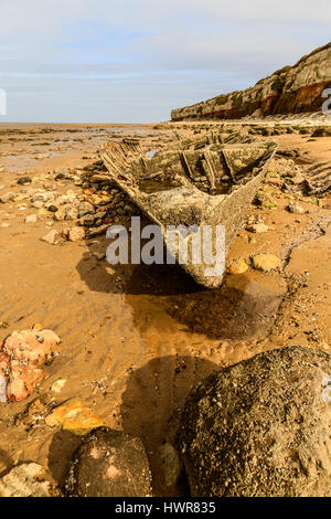 HUNSTANTON, ENGLAND - MARCH 10: Shipwreck of the wooden steam trawler ship/boat 'Sheraton' slowly deteriorating on Hunstanton beach. HDR image. In Hun Stock Photo