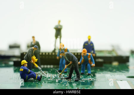 mini workers take action on mainboard on boss and sunrise filter - can use to display or montage products Stock Photo